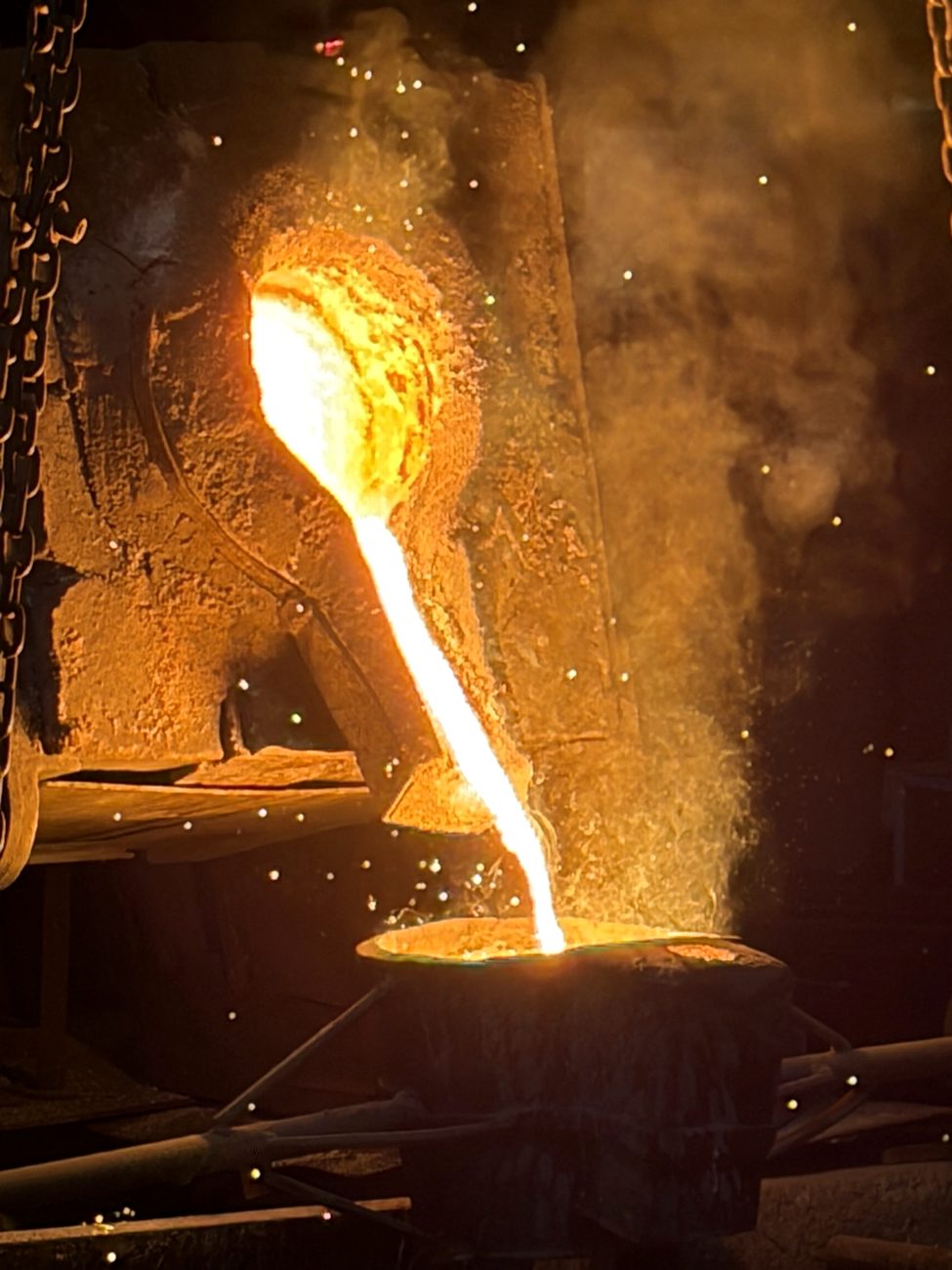 Molten metal being poured from furnace at NCW